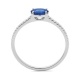 Anillo de oro blanco de 18 Kt con piedra de color y diamantes de 0,09 ct