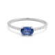 Anillo de oro blanco de 18 Kt con piedra de color y diamantes de 0,09 ct
