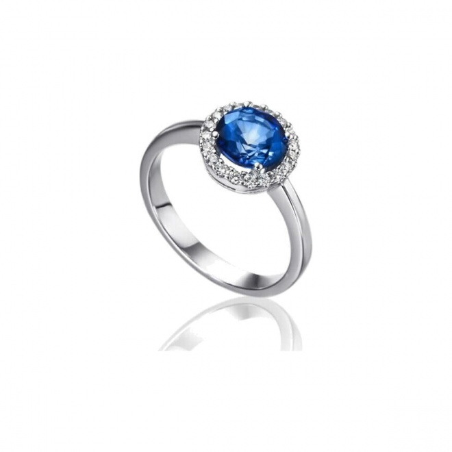 Anillo de oro blanco de 18 Kt con zafiro y orla de diamantes, 0,18 ct