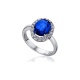 Anillo de oro blanco de 18 Kt con zafiro y orla de diamantes, 0,38 ct