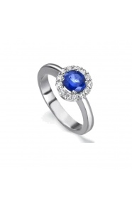 Anillo de oro blanco de 18 Kt con zafiro y orla de diamantes, 0,30 ct