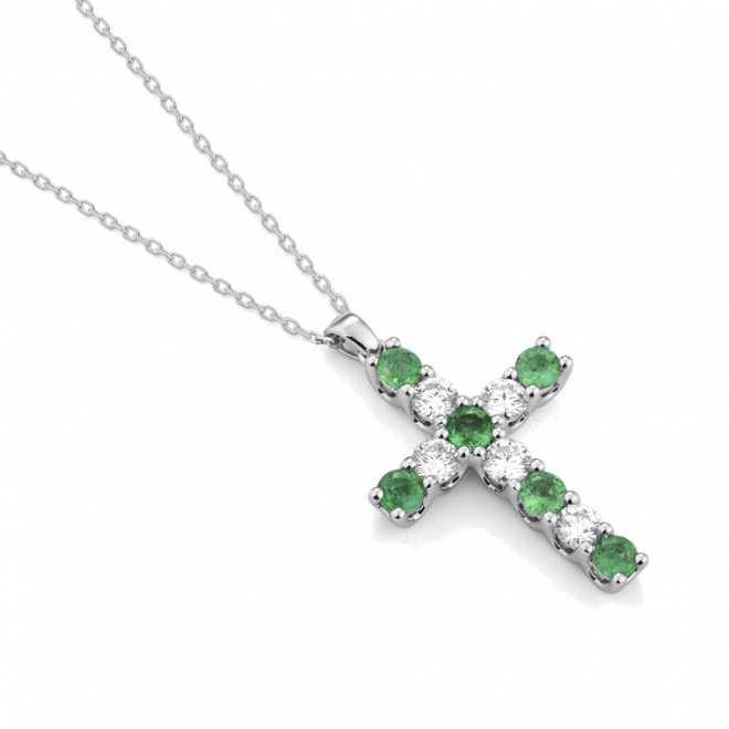 Colgante Cruz de oro blanco de 18 Kt con esmeraldas de 0,70 ct y diamantes de 0,47 ct
