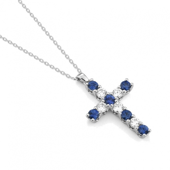 Colgante Cruz de oro blanco de 18 Kt con zafiros azules de 0,66 ct y diamantes de 0,47 ct