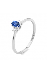 Anillo de oro blanco de 18 Kt con zafiro azul de 0,30 ct y diamantes de 0,05 ct