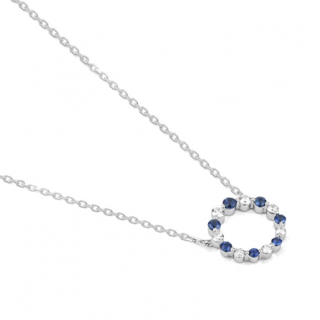 Colgante de oro blanco de 18 Kt con zafiro azules de 0,90 ct y diamantes de 0,10 ct