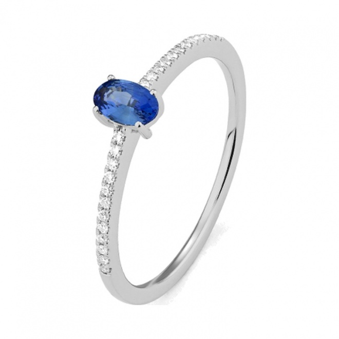 Anillo de oro blanco de 18 Kt con piedra de color y diamantes de 0,07 ct