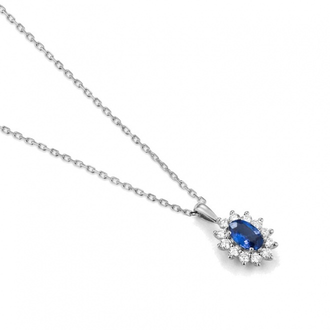 Colgante de oro blanco de 18 Kt con piedra de color y diamantes
