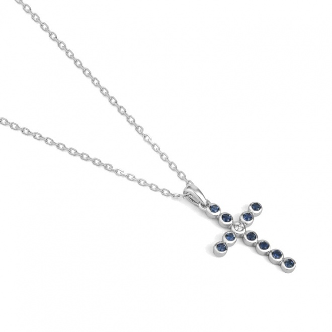 Colgante Cruz de oro blanco de 18 Kt con zafiro de 0,15 ct y diamante de 0,01 ct