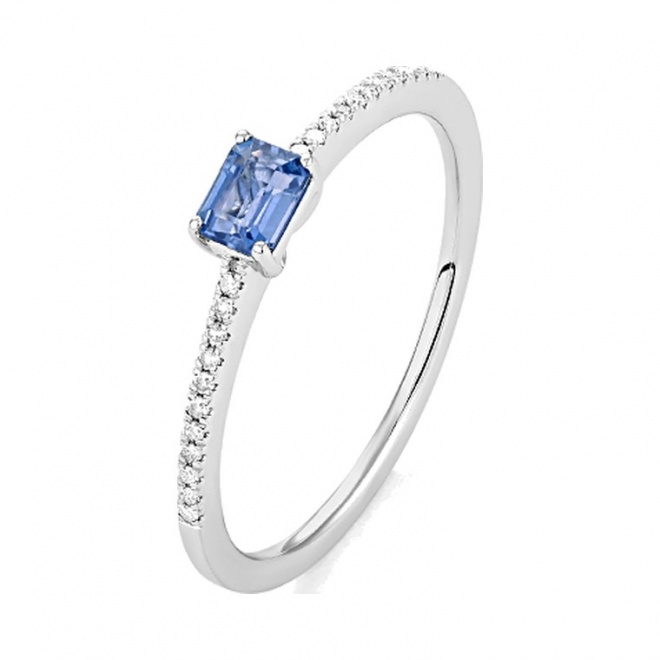 Anillo de oro blanco de 18 Kt con piedra de color y diamantes de 0,06 ct