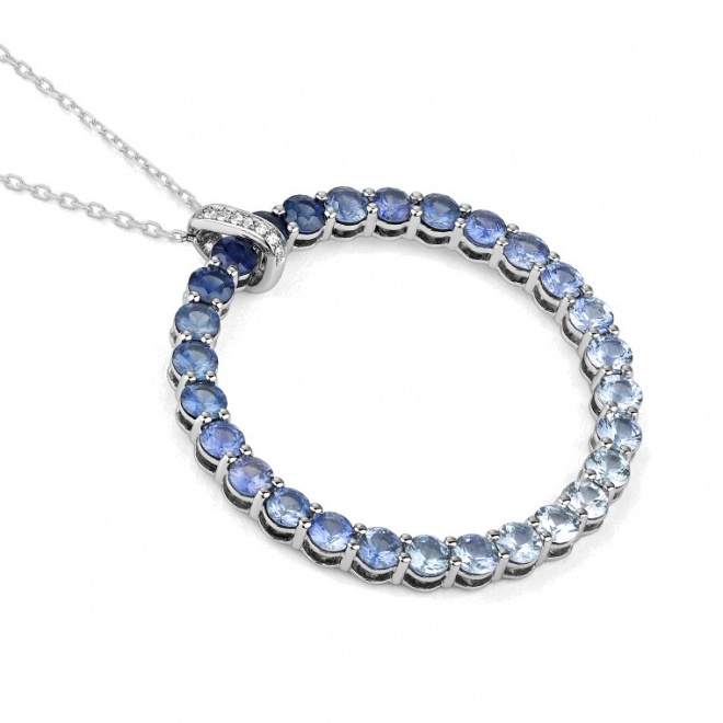 Colgante de oro blanco de 18 Kt con piedra de color y diamantes de 0,02 ct